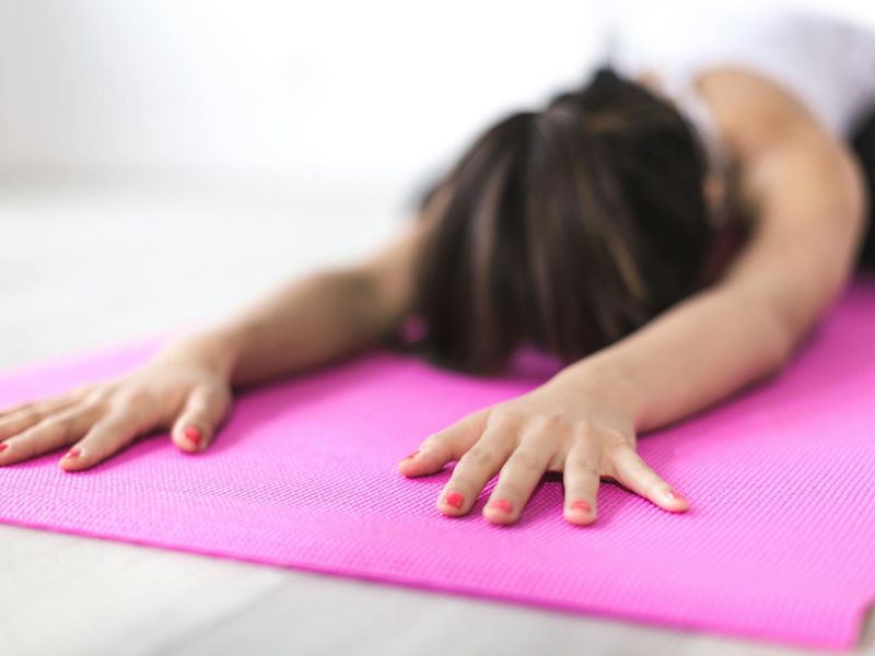 Detail of a woman's hands during a yoga stretch