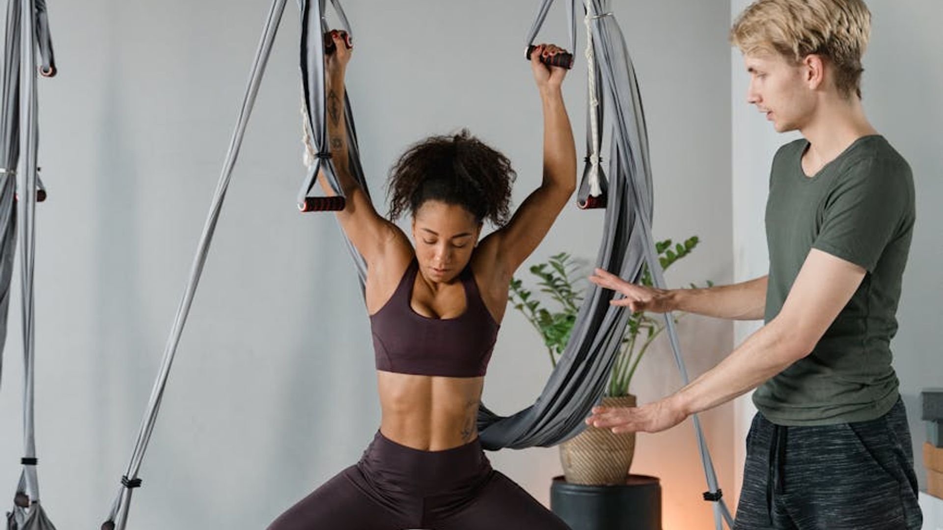Woman practicing mindfulness exercises in a sunlit studio